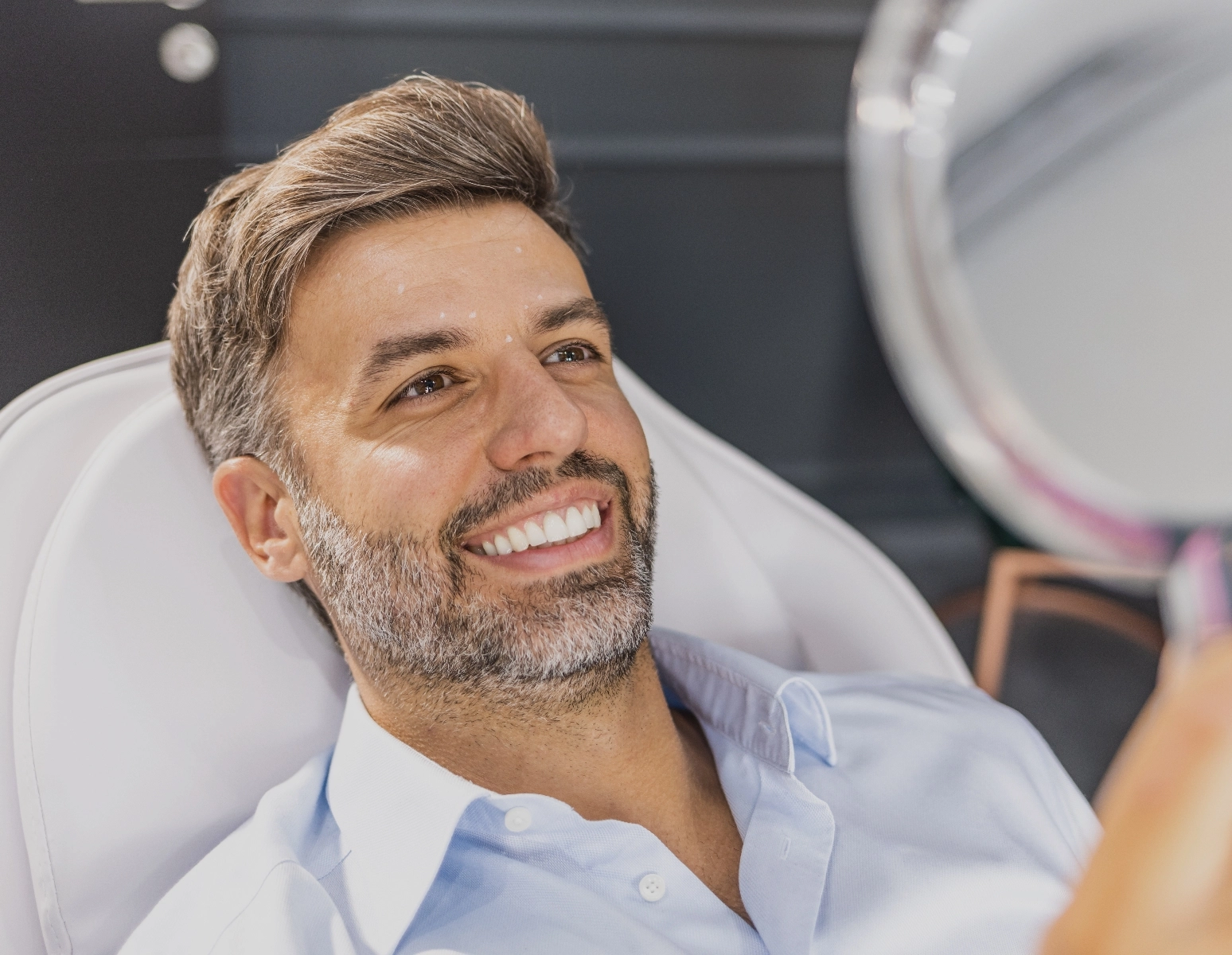 man with injection marks looking in mirror Brotox at HIM plastic Surgery In Dallas, TX